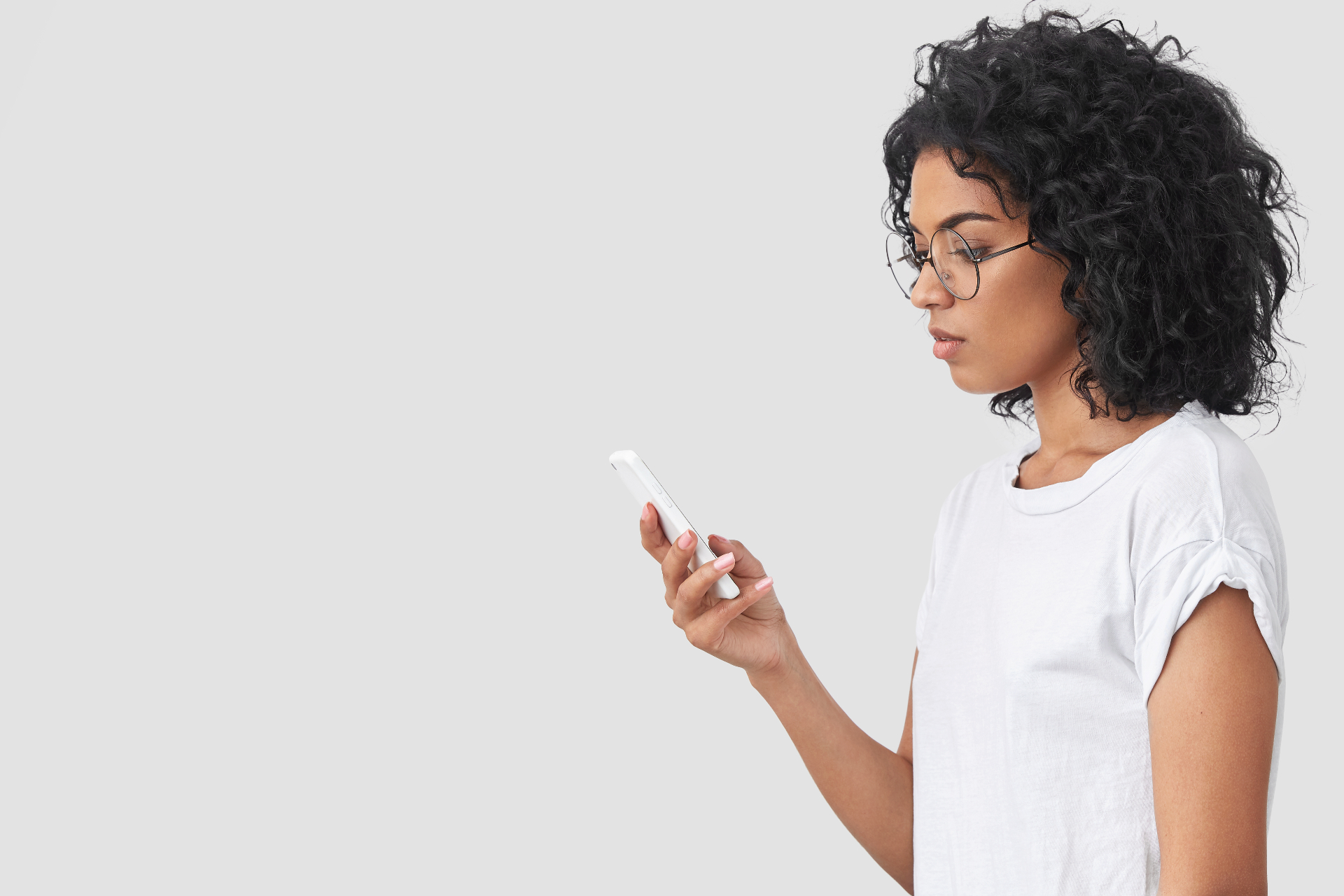 A person checking their phone in an everyday setting