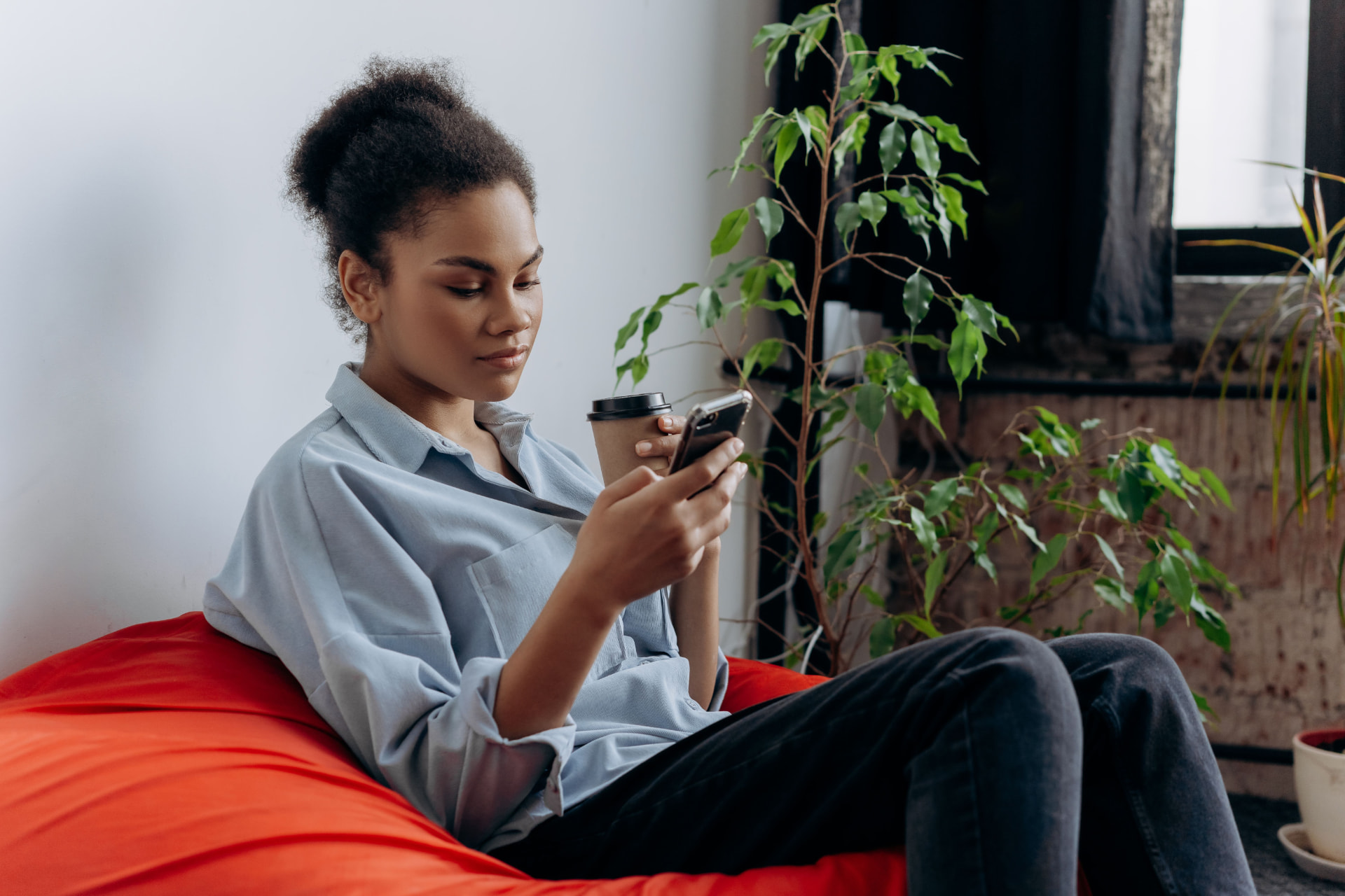 A person reading health information on their phone in a relaxed setting